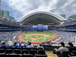 Toronto Blue Jays game at Rogers Centre with open roof and clear sky