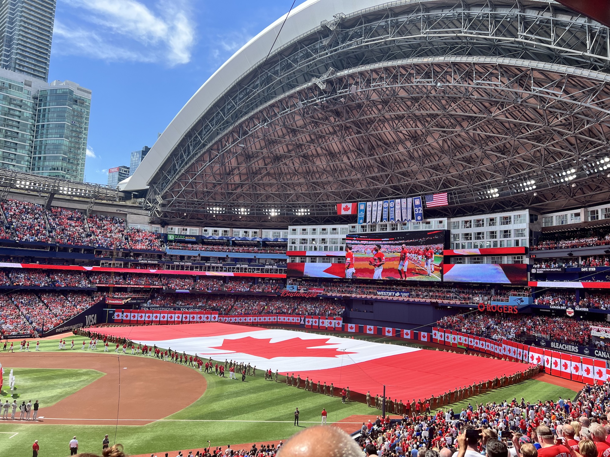 Canada Day ceremony and large on field Canadian Flag at the Rogers Centre