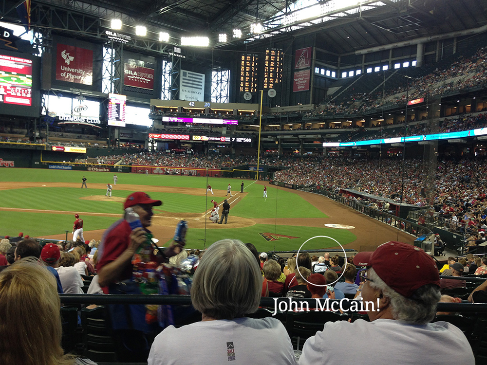 John McCain at Chase Field, sitting in the stands.